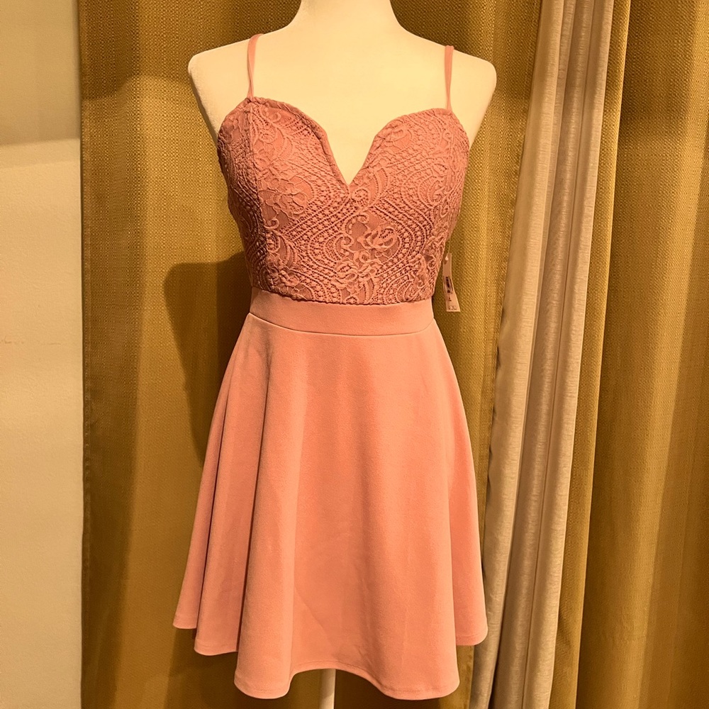 New with tags Sexy soft Pink lace top dress with asymmetrical skirt